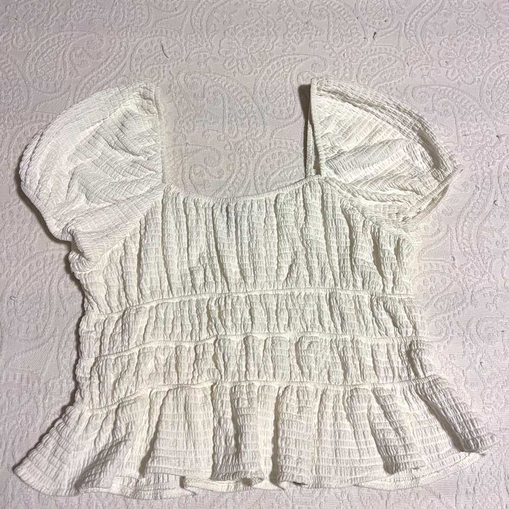 Francesca’s white ruffle top